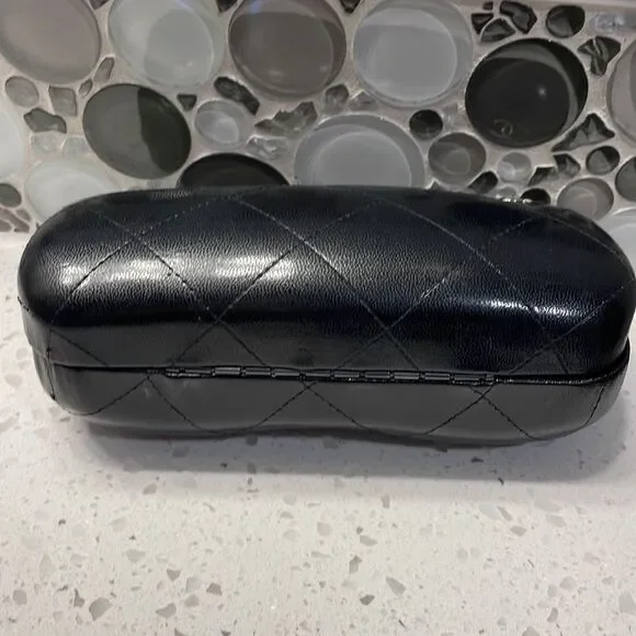 Chanel black leather quilted sunglass case. No sunglasses just the case